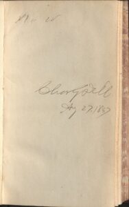 This image is of the front free endpaper of volume one with a handwritten inscription from a previous owner. The inscription is made in ink and contains a name and date written in large, loopy handwriting that is rather difficult to make out. Part of the name may be “Charles,” and the year listed is 1887.